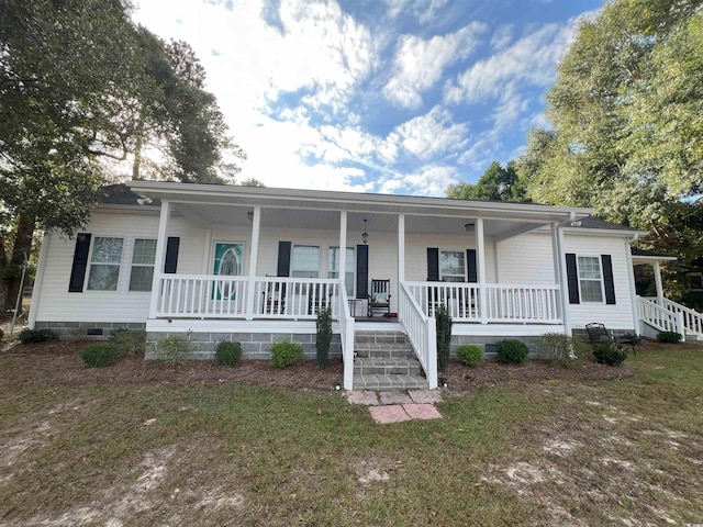 ranch-style house featuring a porch