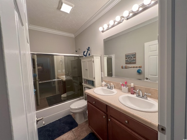 full bathroom featuring enclosed tub / shower combo, a textured ceiling, crown molding, tile patterned floors, and toilet