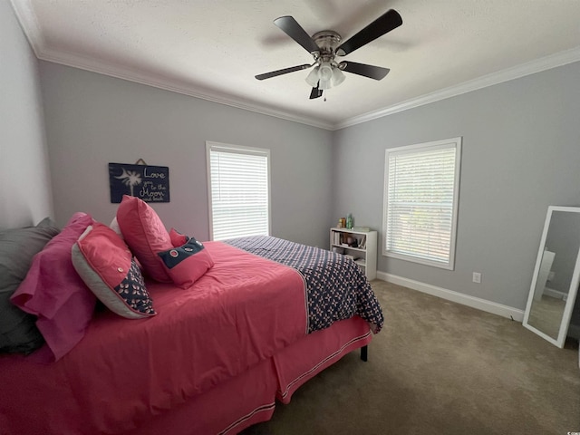 carpeted bedroom featuring multiple windows, ceiling fan, and crown molding