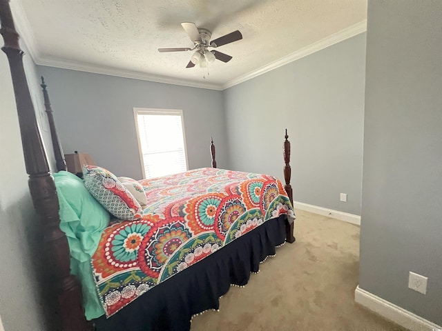 bedroom with ornamental molding, a textured ceiling, light carpet, and ceiling fan