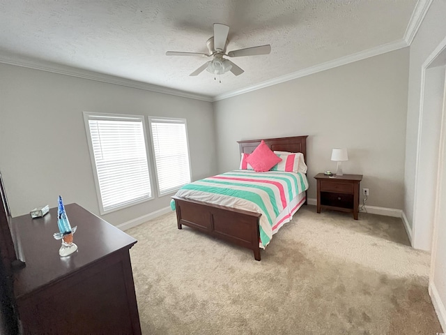 bedroom with ornamental molding, light colored carpet, a textured ceiling, and ceiling fan