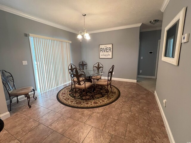 dining area featuring a chandelier, a textured ceiling, and ornamental molding