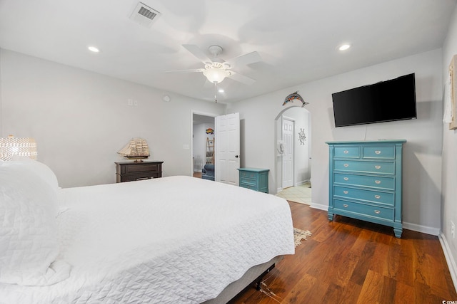 bedroom featuring ceiling fan and dark hardwood / wood-style floors