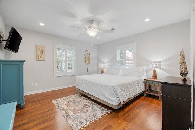 bedroom featuring ceiling fan and dark wood-type flooring