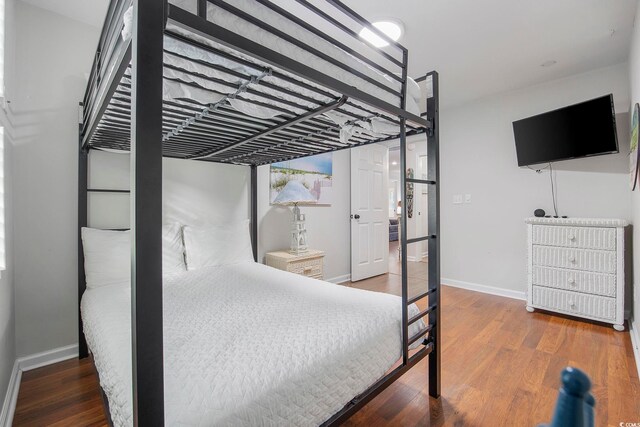 bedroom with wood-type flooring