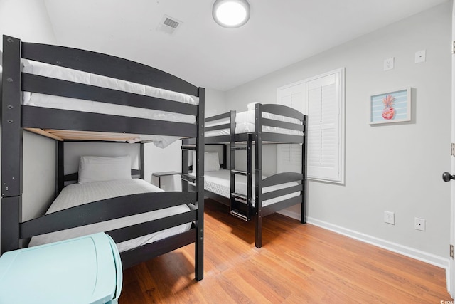 bedroom with light hardwood / wood-style floors