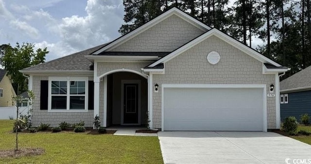 570 Slaty Dr, Myrtle Beach, SC 29588 - view of front of home featuring a garage, concrete driveway, and a front yard