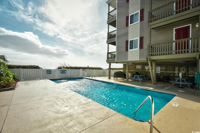 view of swimming pool with a patio