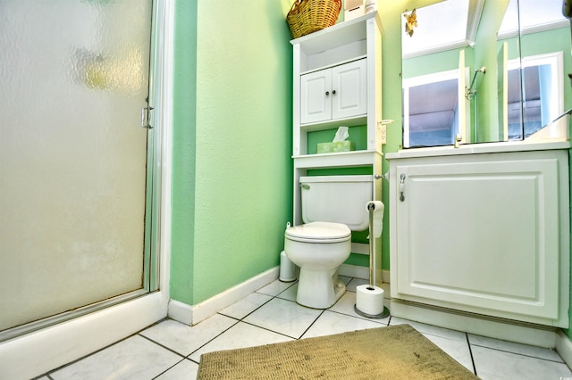 bathroom with toilet, a shower with shower door, and tile patterned flooring