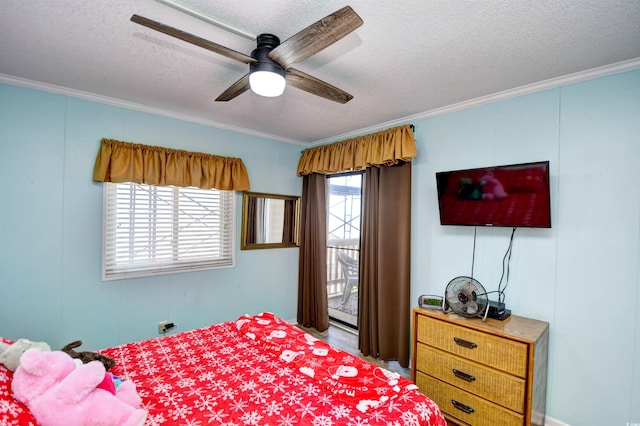 bedroom featuring a textured ceiling, ceiling fan, and crown molding