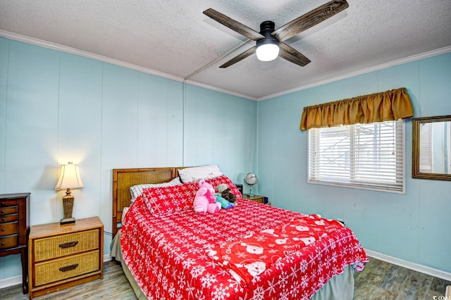 bedroom with ceiling fan, wood-type flooring, crown molding, and a textured ceiling