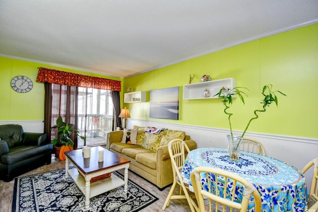 living room with crown molding, hardwood / wood-style floors, and a textured ceiling