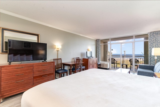 bedroom featuring expansive windows, access to outside, light hardwood / wood-style floors, and crown molding