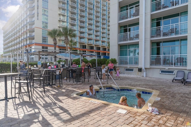 view of pool featuring a patio