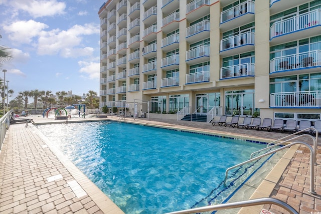 view of swimming pool with a patio