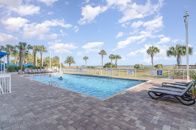 view of swimming pool featuring a patio area