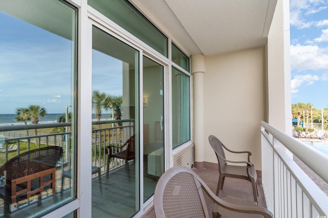 balcony featuring a water view