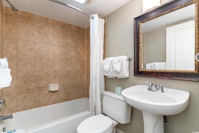 bathroom featuring toilet and shower / bathtub combination with curtain