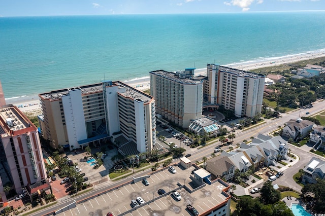 aerial view featuring a view of the beach and a water view