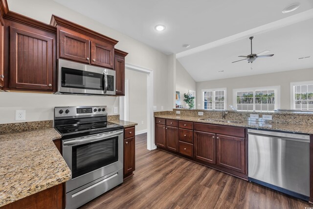 2327 King Farm Rd, Aynor, SC 29511 - kitchen featuring stainless steel appliances, dark wood finished floors, a sink, ceiling fan, and light stone countertops