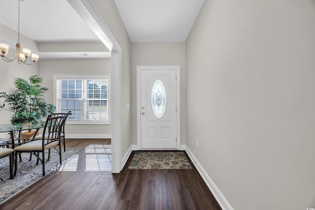 2327 King Farm Rd, Aynor, SC 29511 - foyer entrance featuring an inviting chandelier, dark wood-style floors, and baseboards