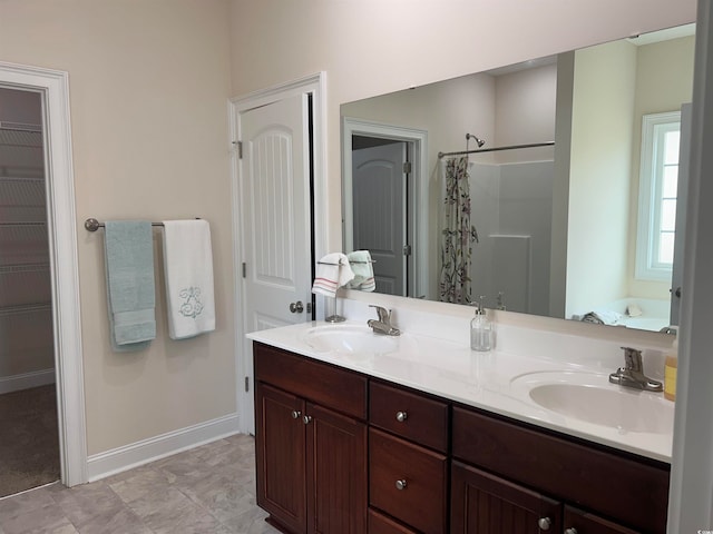 bathroom featuring vanity and plus walk in shower