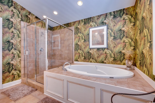 bathroom with tile patterned flooring and separate shower and tub