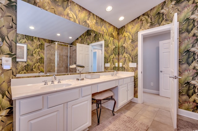 bathroom with vanity, walk in shower, and tile patterned floors