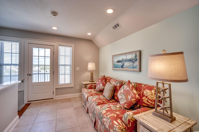 tiled living room with vaulted ceiling