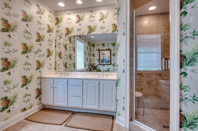 bathroom featuring vanity, a shower with shower door, tile patterned floors, and ornamental molding