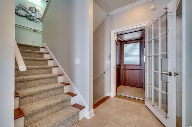 tiled entryway with crown molding