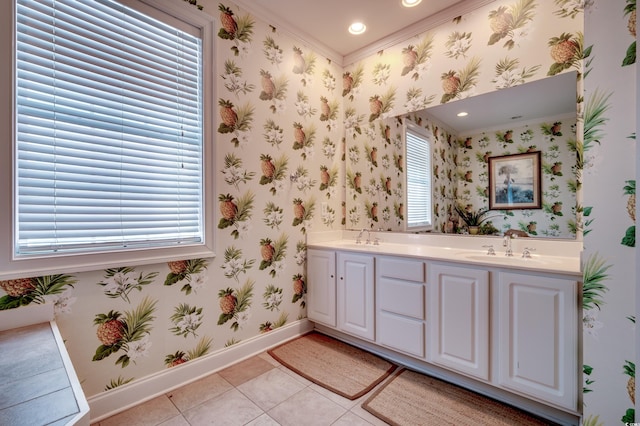 bathroom featuring tile patterned flooring, ornamental molding, and plenty of natural light