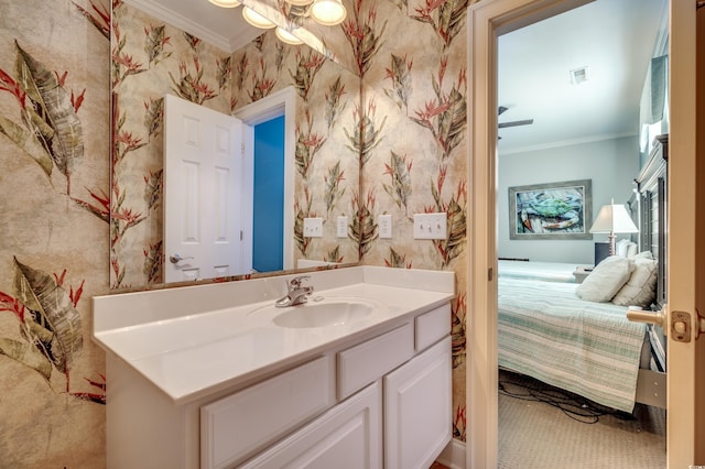 bathroom with vanity, ceiling fan, and crown molding