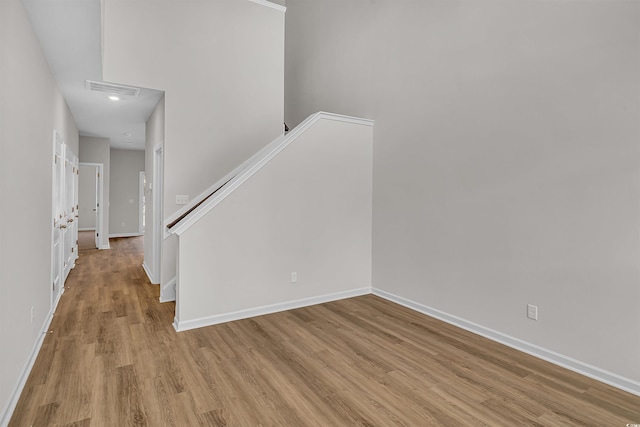 interior space with baseboards, recessed lighting, light wood finished floors, and visible vents