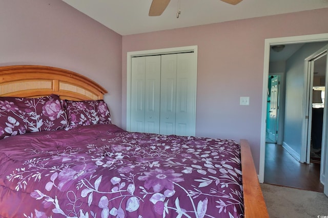 carpeted bedroom featuring ceiling fan and a closet