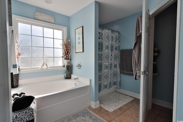 bathroom featuring tile patterned flooring and independent shower and bath