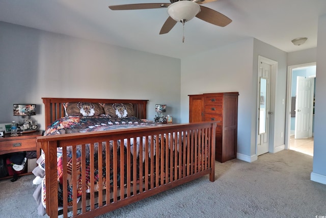 bedroom with ceiling fan and light colored carpet