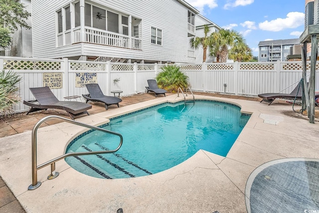 view of swimming pool with a patio area