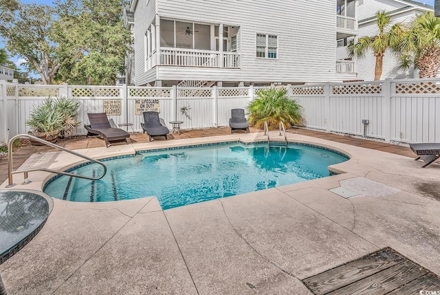 view of swimming pool with a patio