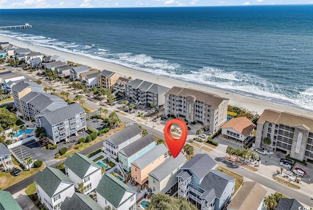 drone / aerial view with a view of the beach and a water view