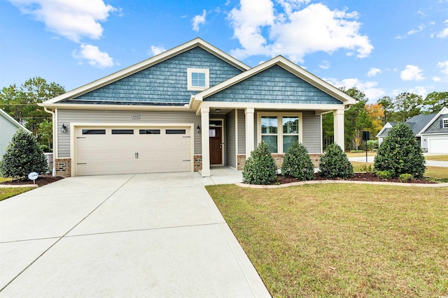 craftsman inspired home featuring a front yard and a garage