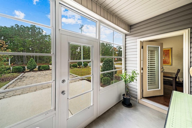 sunroom / solarium featuring wooden ceiling