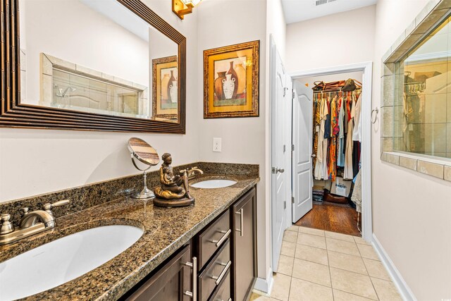 bathroom featuring tile patterned flooring and vanity