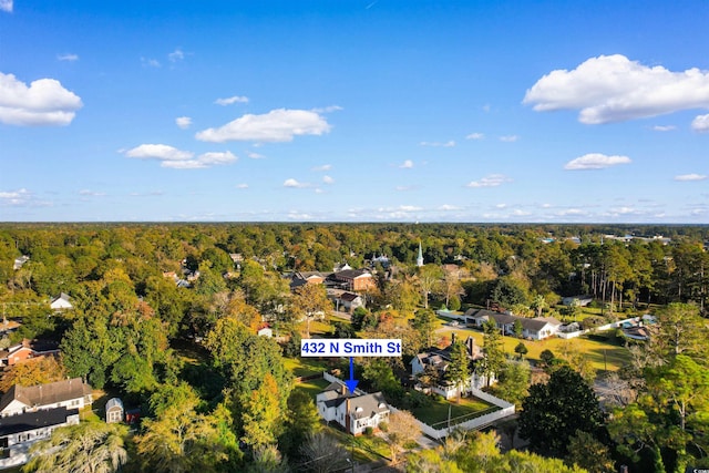 birds eye view of property with a forest view and a residential view