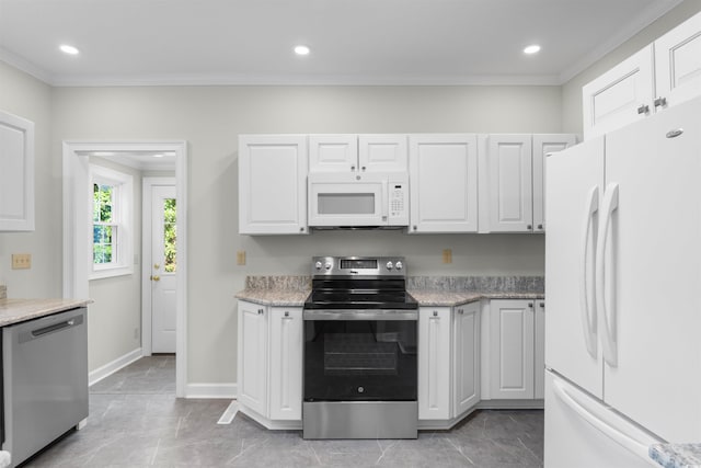 kitchen with stainless steel appliances, ornamental molding, white cabinetry, and recessed lighting