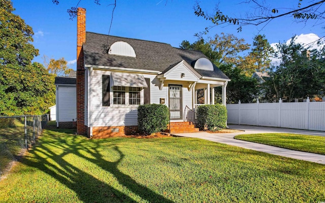 cape cod home with fence private yard, crawl space, a chimney, and a front yard