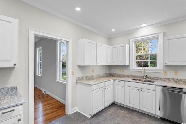 kitchen featuring recessed lighting, ornamental molding, white cabinetry, a sink, and dishwasher