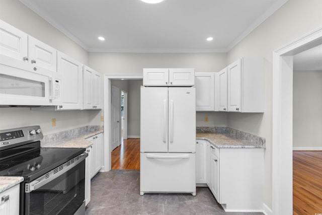 kitchen with light stone counters, recessed lighting, white appliances, white cabinets, and ornamental molding