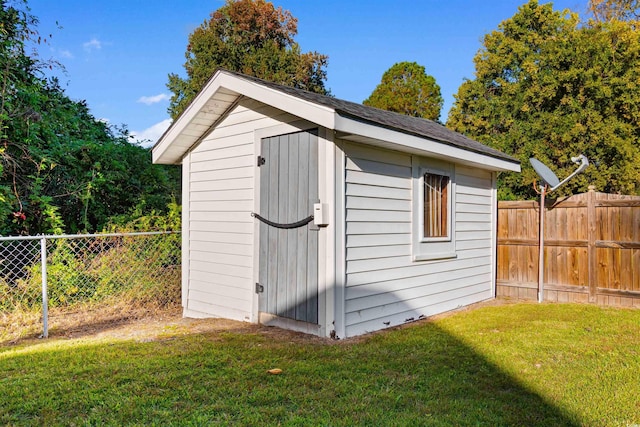 view of shed featuring a fenced backyard