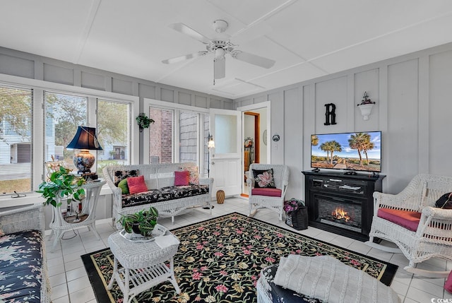 tiled living room with ceiling fan